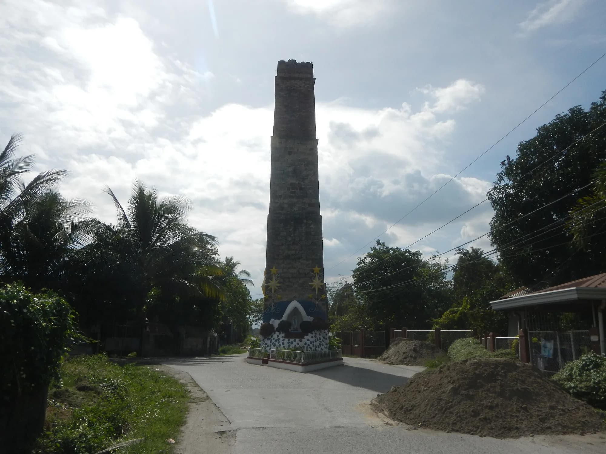 One of Magalang's tall brick heliograph towers beside a road
