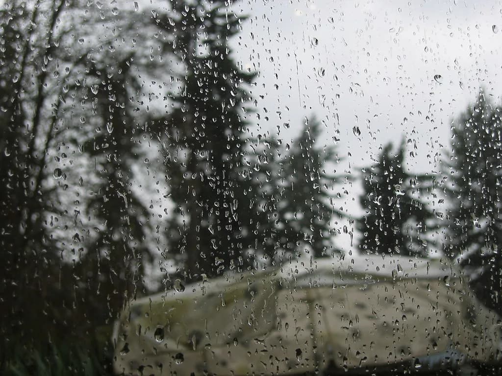 Raindrops on a window (illustrative photo)