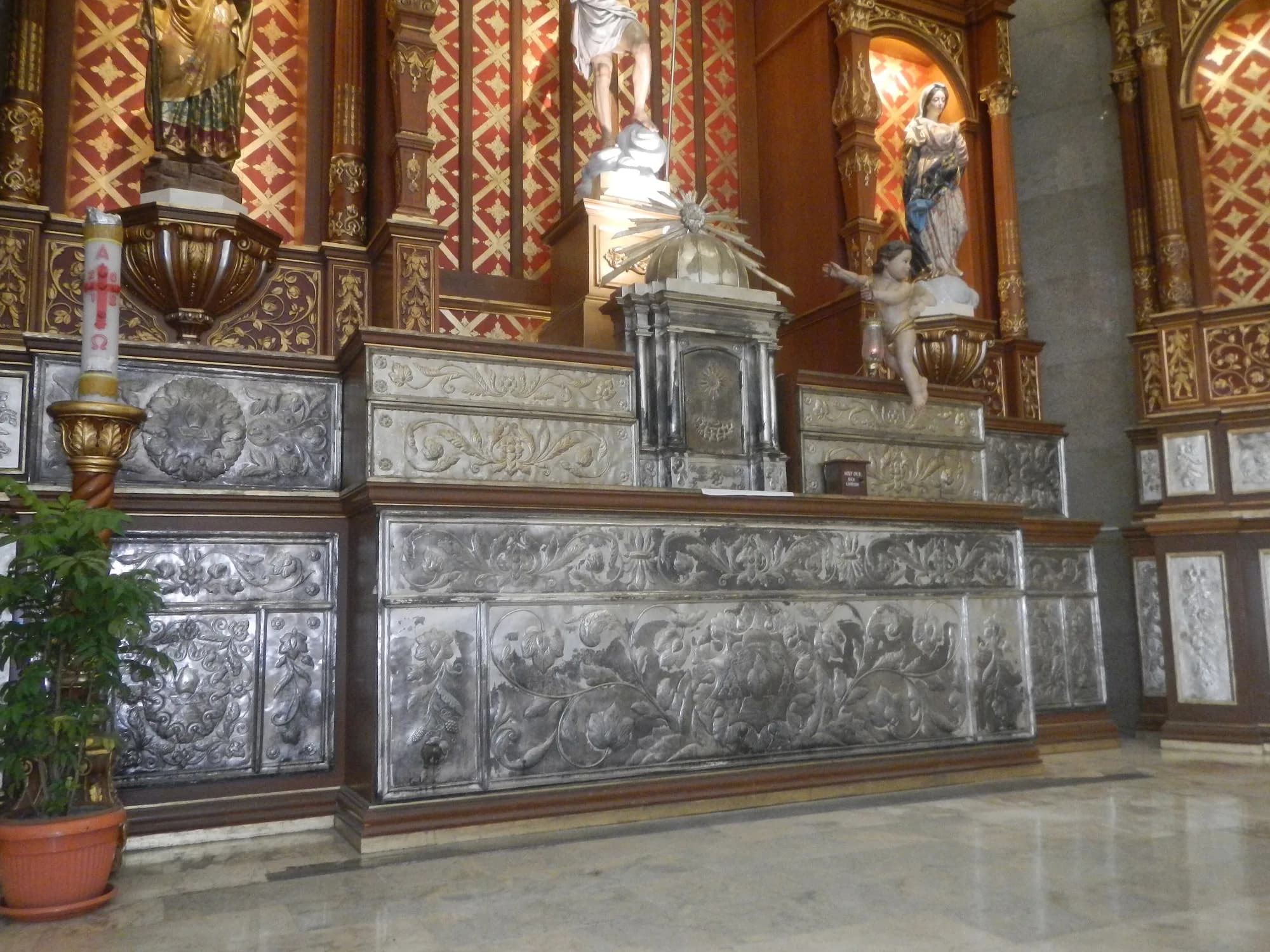 Ornate silver and wood altar inside Santa Monica Parish Church, Mexico