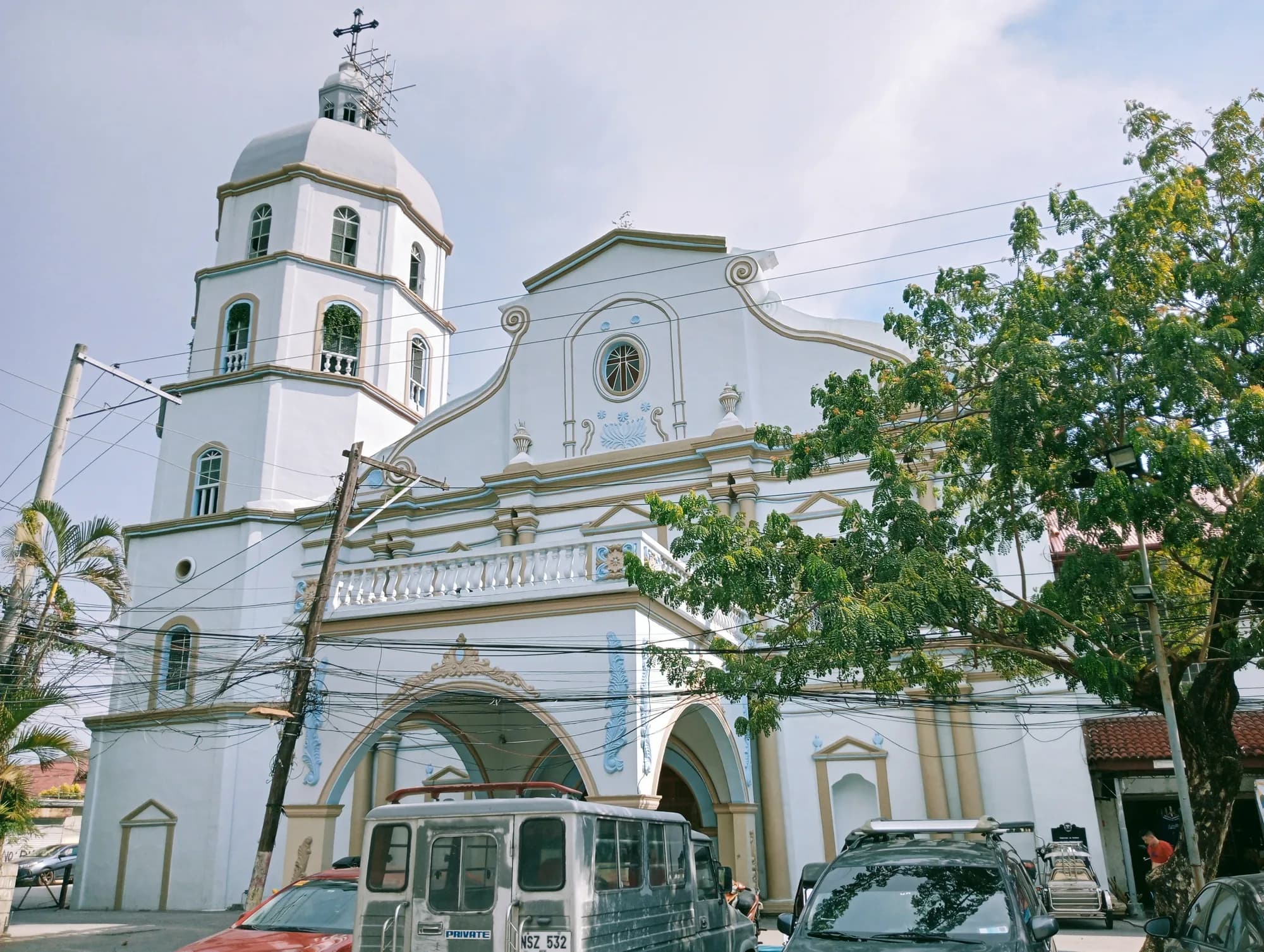 The white facade and bell tower of Guagua Church